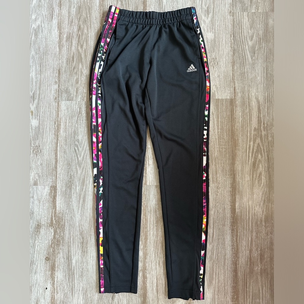 Adidas women’s black track pants with multicolor stripes